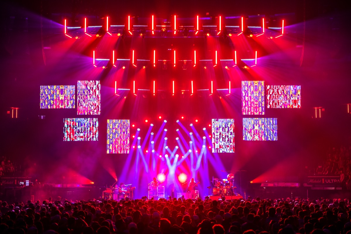 Goose at Madison Square Garden in deep red light with mosaic content on the LED panels