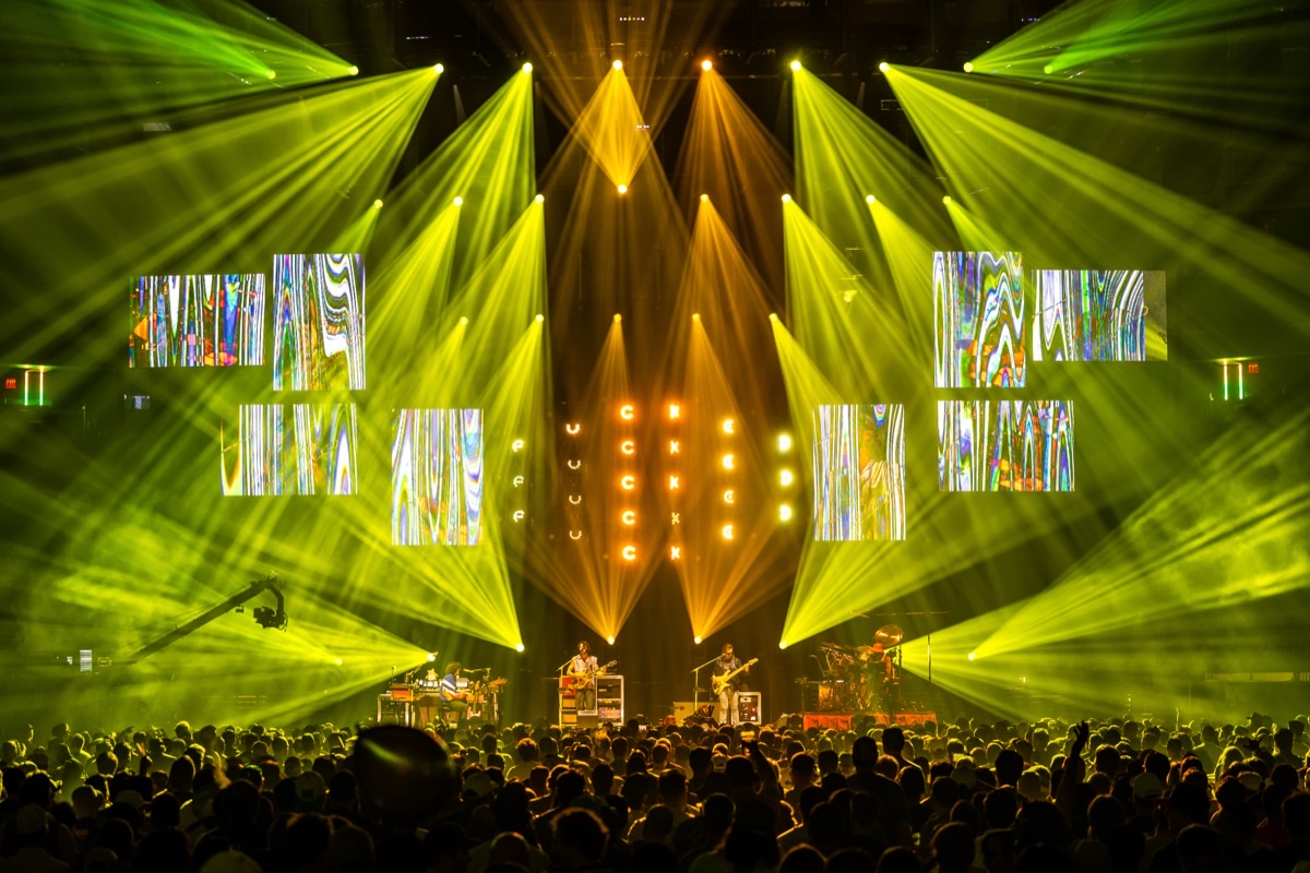 Goose at Madison Square Garden under a green and gold light show, with Enhaus content on the LED screens